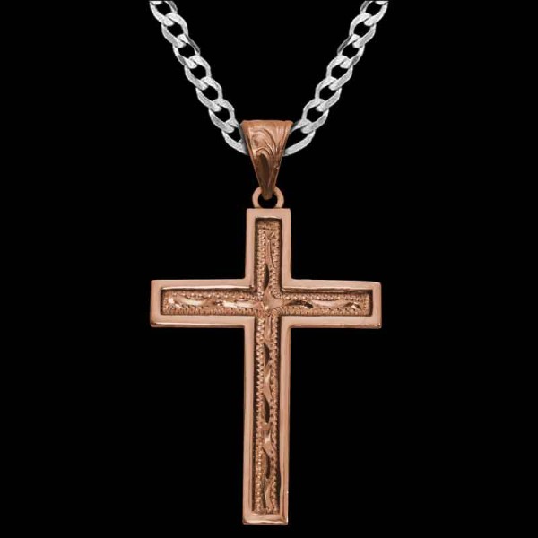 Our Noah Cross Pendant is handcrafted on a Copper base, featuring a classic traditional design with hand-engraved scrollwork and a smooth edge.

Size: 1.5"" x 2.0""

Get a Sterling Silver chain at a discounted price when you buy th